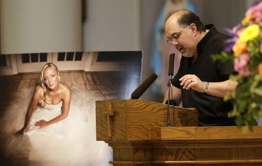 Recording executive Jimmy Nichols speaks during a memorial service for country singer Mindy McCready on Wednesday, March 6, 2013, in Nashville, Tenn. McCready committed suicide Feb. 17 in Heber Springs, Ark. (AP Photo/Mark Humphrey)