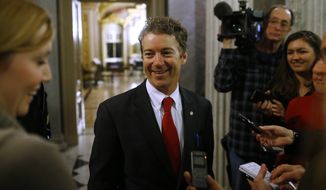 Sen. Rand Paul, R-Ky., leaves the floor of the Senate after his filibuster of the nomination of John Brennan to be CIA director on Capitol Hill in Washington, early Thursday, March 7, 2013. (AP Photo/Charles Dharapak)

