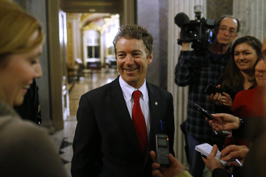 Sen. Rand Paul, R-Ky., leaves the floor of the Senate after his filibuster of the nomination of John Brennan to be CIA director on Capitol Hill in Washington, early Thursday, March 7, 2013. (AP Photo/Charles Dharapak)