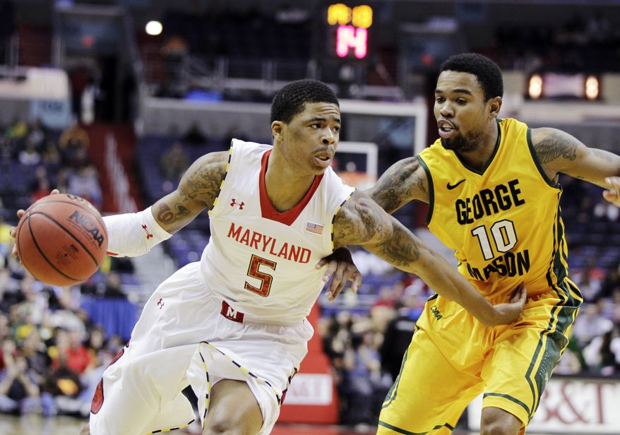 **FILE** Maryland's Nick Faust (5) drives against George Mason's Sherrod Wright (10) during the second half of an NCAA college basketball game at the BB&T Classic in Washington, Sunday, Dec. 2, 2012. Maryland won 69-62. (AP Photo/Luis M. Alvarez)