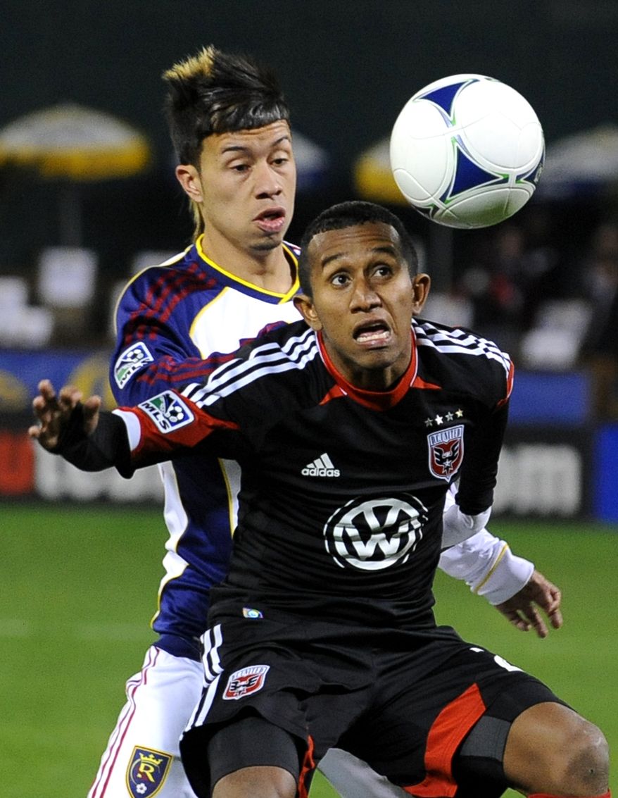 D.C. United midfielder Marcos Sanchez, front, tries to head the ball away from Real Salt Lake midfielder Sebastian Velasquez during the first half of an MLS soccer game, Saturday, March 9, 2013, in Washington. (AP Photo/Richard Lipski)