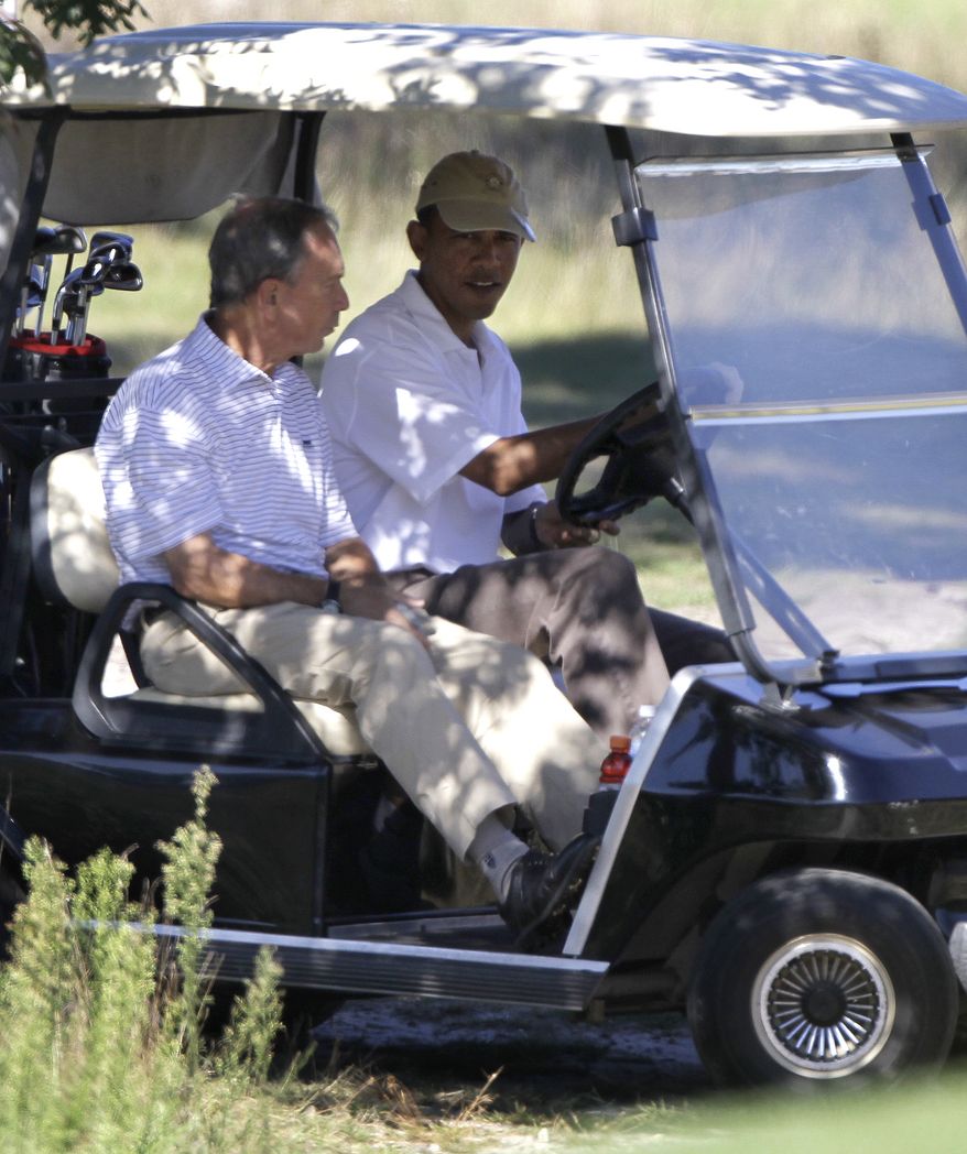 **FILE** New York City Mayor Michael Bloomberg (left) rides in a golf cart driven by President Obama while playing golf at Vineyard Golf Club, in Edgartown, Mass., on the island of Martha&#39;s Vineyard on Aug. 27, 2010. (Associated Press)