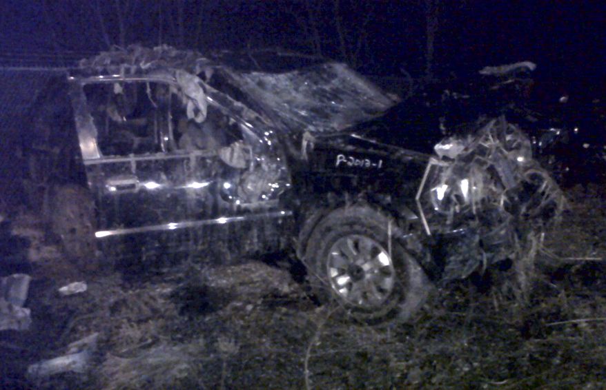 A Honda Passport that crashed into a guardrail and flipped over into a swampy pond on the morning of March 10, 2013, in Warren, Ohio. Highway Patrol officials say speed was a factor in the violent early morning crash that killed six teenagers. (Associated Press)