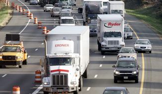**FILE** Traffic on Interstate 95 near the Capital Beltway exit in Beltsville, Md. (Associated Press)