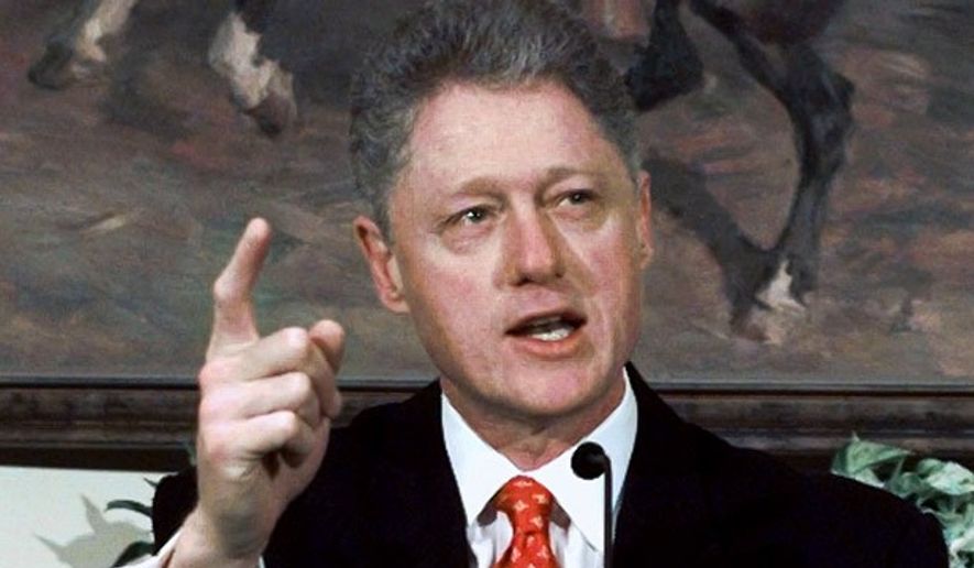 President Bill Clinton emphatically denies having a sexual relationship with former White House intern Monica Lewinsky during a White House event on after-school childcare on Jan. 26, 1998. (Associated Press) ** FILE **