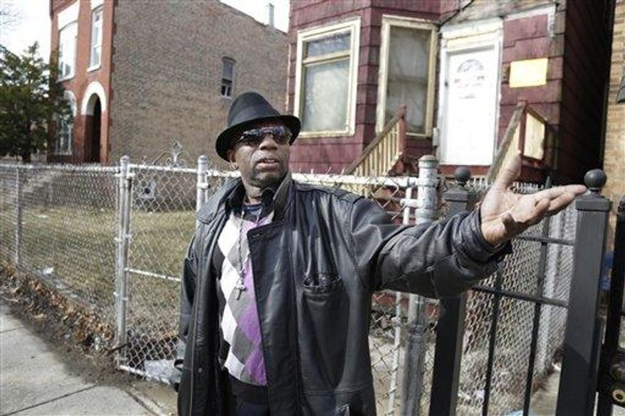 Neighborhood resident Carl Whitehead expresses outrage near the sight of a shooting Tuesday, March 12, 2013, in Chicago where a 6 month-old girl and her father were shot Monday, March 11. Six-month old Jonylah Watkins became the latest homicide victim of a bloody gang war in Chicago when a man approached a van in which her father, a known gang member, was changing her diaper and opened fire. The infant died early Tuesday morning, after being shot five times. Her father, Jonathan Watkins, was in serious but stable condition. (Associated Press)