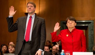Richard Cordray and Mary Jo White are sworn in March 12, 2013, before testifying in front of the U.S. Senate Banking, Housing and Urban Affairs Committee on Capitol Hill for their confirmation hearings. Cordray and White are President Obama&#39;s picks to head the Consumer Financial Protection Bureau and the Securities and Exchange Commission, respectively. (Andrew Harnik/The Washington Times)