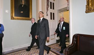 President Obama leaves the Capitol in Washington on March 12, 2013, after visiting with Senate Democrats in the first of four meetings with lawmakers this week to discuss the budget. (Associated Press)
