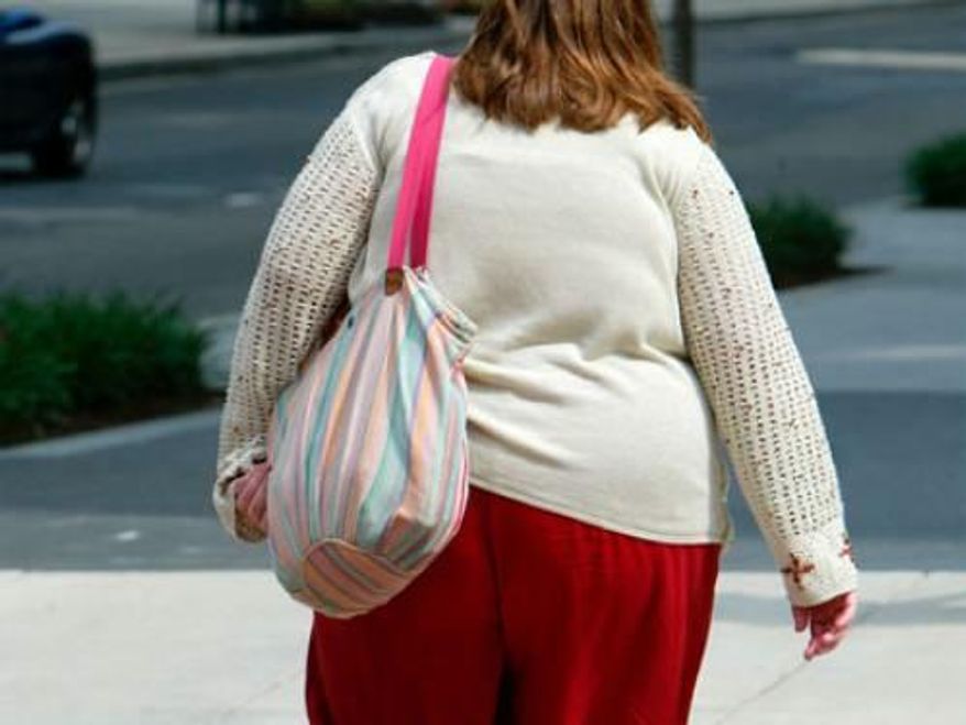 America's weight problem is proving a much heftier drag on the economy than previously thought. (Associated Press)