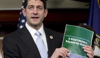 **FILE** House Budget Committee Chairman Rep. Paul Ryan, Wisconsin Republican, holds up a copy of the House Budget Committee 2014 Budget Resolution as he speaks during a news conference on Capitol Hill in Washington on March 12, 2013. (Associated Press)