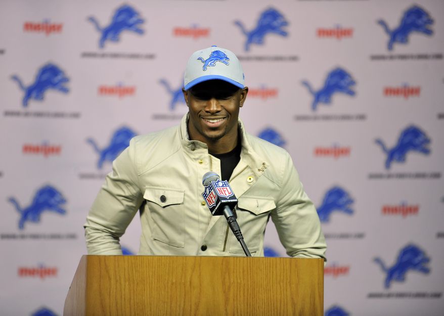 Reggie Bush speaks at a news conference after agreeing to a four-year deal with the Detroit Lions NFL football team, Wednesday, March 13, 2013 in Detroit. (AP Photo/Detroit News, John T. Greilick)
