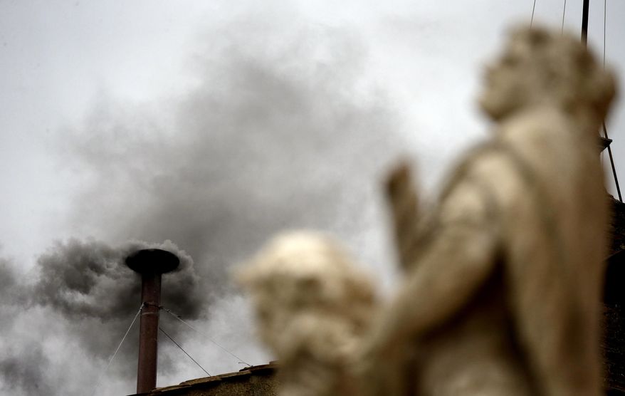 Black smoke billows from the chimney of the Sistine Chapel, meaning Roman Catholic cardinals have not elected a pope in their second or third rounds of balloting, at the Vatican, Wednesday, March 13, 2013. Cardinals voted twice Wednesday in Michelangelo's famed frescoed chapel after a first vote Tuesday in a conclave to elect a successor to Benedict XVI, who stunned the Catholic world last month by becoming the first pope in 600 years to resign. (AP Photo/Gregorio Borgia)