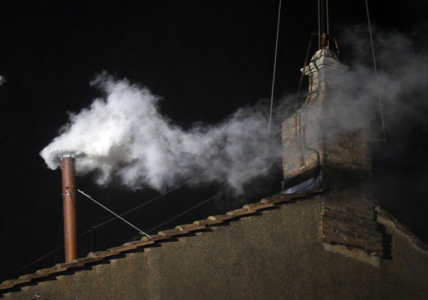 White smoke emerges from the chimney on the roof of the Sistine Chapel, in St. Peter's Square at the Vatican, Wednesday, March 13, 2013. The white smoke indicates that the new pope has been elected. (AP Photo/Gregorio Borgia)