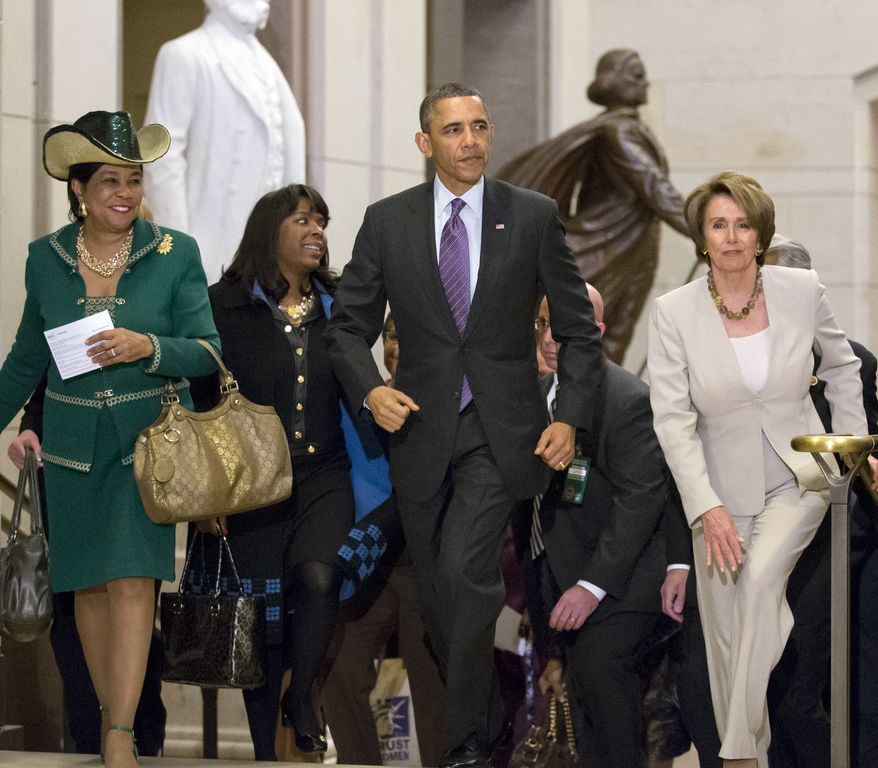 President Obama and House Minority Leader Nancy Pelosi, California Democrat, leave a meeting with House Democrats at the Capitol on March 14, 2013, joined by Democratic Reps. Frederica Wilson (left) of Florida and Terri Sewell (second from left) of Alabama. (Associated Press)