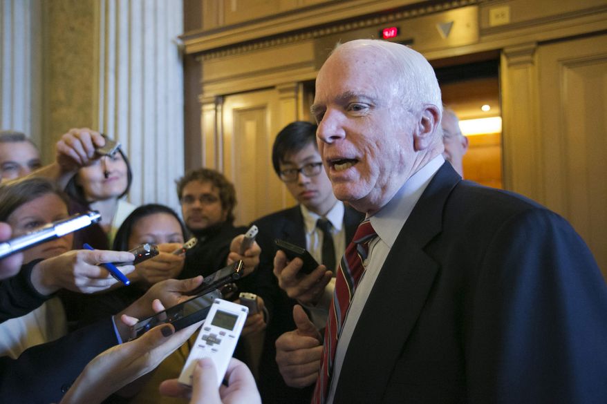 ** FILE ** In this March 7, 2013, file photo, Sen. John McCain, R-Ariz. speaks with reporters on Capitol Hill in Washington. (AP Photo/J. Scott Applewhite, File)