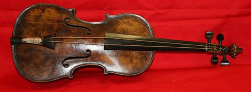 This undated photo shows the violin that was played by bandmaster Wallace Hartley of the Titanic as the oceanliner sank. Hartley's violin was believed lost in the 1912 disaster, but auctioneers Henry Aldridge & Son say an instrument unearthed in 2006 has undergone rigorous testing and proven to be his. (AP Photo/Henry Aldridge)