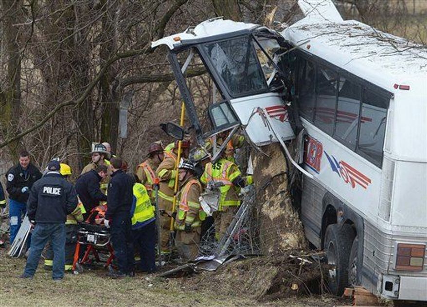 Emergency and rescue crews respond to the scene of a tour bus crash on the Pennsylvania Turnpike on Saturday, March 16, 2013 near Carlisle, Pa. (AP Photo/The Sentinel, Jason Malmont )