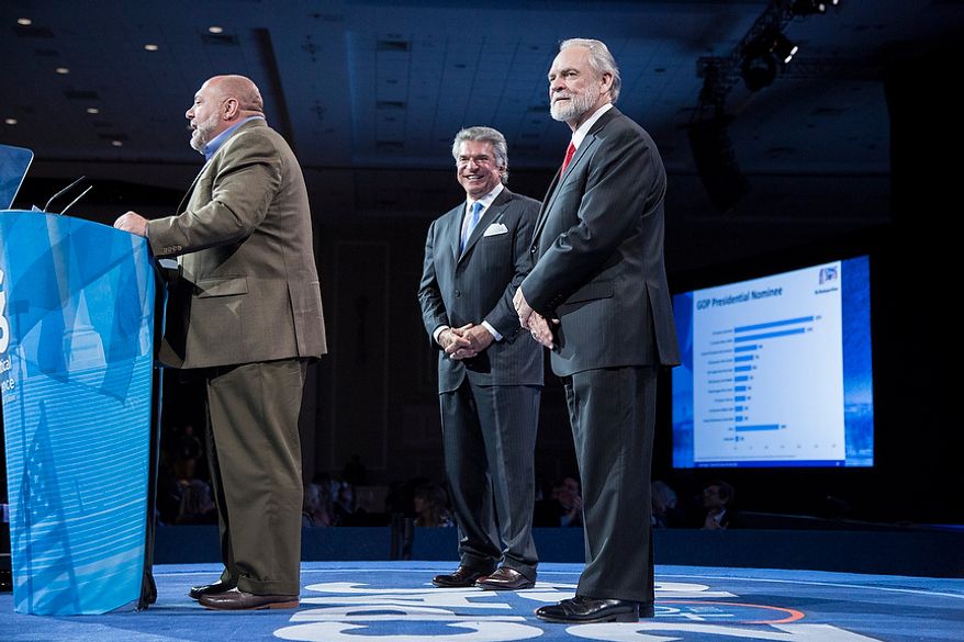 Tony Fabrizio, from left, of the Fabrizio-McLaughlin polling firm, announces the results of the Washington Times/CPAC 2013 straw poll with Al Cardenas, chairman of the American Conservative Union, and Larry Beasley, president and CEO of The Washington Times, during the final day of the 2013 Conservative Political Action Conference in Fort Washington, Md. on March 16, 2013. Sen. Rand Paul (R-KY) was the winner, narrowly edging out the close second place Sen. Marco Rubio (R-FL). (T.J. Kirkpatrick/Special to The Washington Times)
