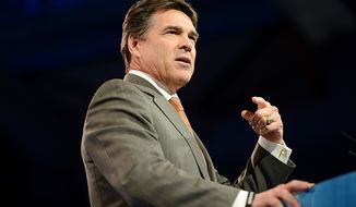 ** FILE ** Texas Gov. Rick Perry speaks at the Conservative Political Action Conference at the Gaylord National Hotel in National Harbor, Md., on Thursday, March 14, 2013. (Andrew Harnik/The Washington Times)