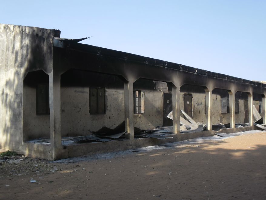 **FILE** A burnt-out school block in Potiskum, Nigeria, is seen here on Oct. 20, 2012, following a gun battle and explosions by the Boko Haram sect. (Associated Press)