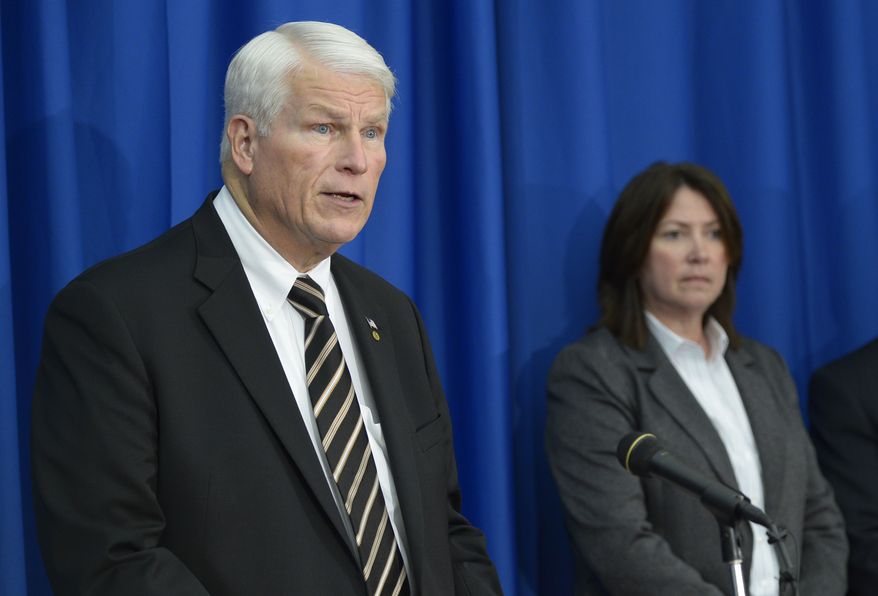 University of Central Florida president John Hitt (left) answers questions March 18, 2013, in Orlando, Fla., during a news conference after the apparent suicide of UCF student James Oliver Seevakumaran in his dorm room. Seevakumaran's body was found with an assault rifle and explosive devices. At right is ATF special agent Julie Torrez. (Associated Press)