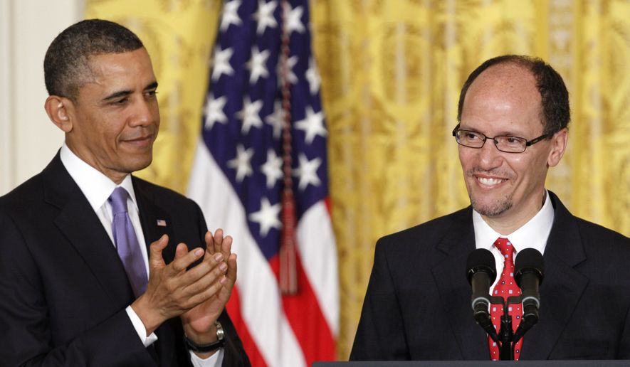 **FILE** President Obama applauds in the East Room of the White House in Washington on March 18, 2013, during his announcement that he would nominate Thomas E. Perez (right) for Labor secretary. (Associated Press)