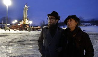 In this Jan. 17, 2013 photo, Sean Lennon and actress Susan Sarandon visit a fracking site in New Milford, Pa. Dozens of celebrities may be running afoul of the law as they unite under the banner of a group, Artists Against Fracking, that opposes hydraulic fracturing and boasts members including Yoko Ono and actors Mark Ruffalo and Susan Sarandon. (AP Photo/Richard Drew, File)