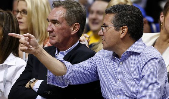 Washington Redskins owner Dan Snyder, right, watches a Phoenix Suns versus Los Angeles Lakers matchup with Redskins head coach Mike Shanahan in the second half of an NBA basketball game on Monday, March 18, 2013, in Phoenix. The Suns defeated the Lakers 99-76. (AP Photo/Ross D. Franklin)