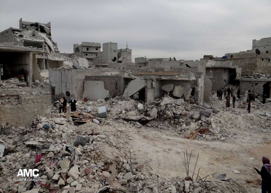 In this citizen journalism image provided by Aleppo Media Center AMC which has been authenticated based on its contents and other AP reporting, Syrian citizens inspect houses that were destroyed from a Syrian forces airstrike, at al-Marjeh neighborhood, in Aleppo, Tuesday, March 19, 2013. (AP Photo/Aleppo Media Center, AMC)