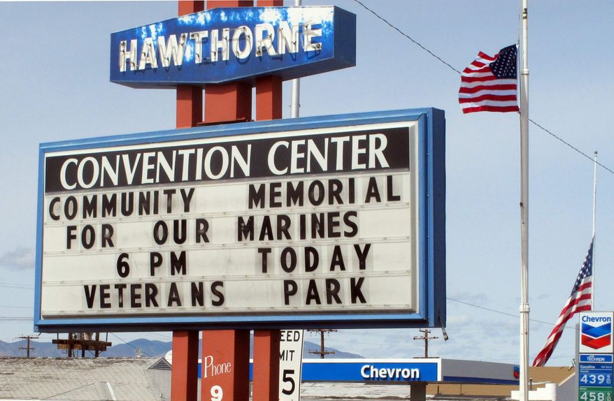A sign telling residents about a memorial service is posted at the Convention Center in Hawthorne, Nev., near the Hawthorne Army Depot on Tuesday, March 19, 2013, where seven Marines were killed and several others seriously injured in a training accident Monday night, about 150 miles southeast of Reno in Nevada's high desert. (AP Photo/Scott Sonner)