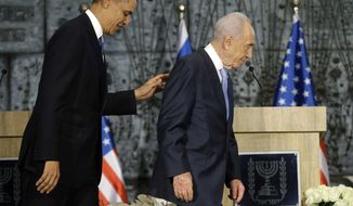 ** FILE ** President Obama and Israeli President Shimon Peres walk off stage following their joint statement to members of the media at the President’s Residence in Jerusalem, Israel, March 20, 2013, (Associated Press)