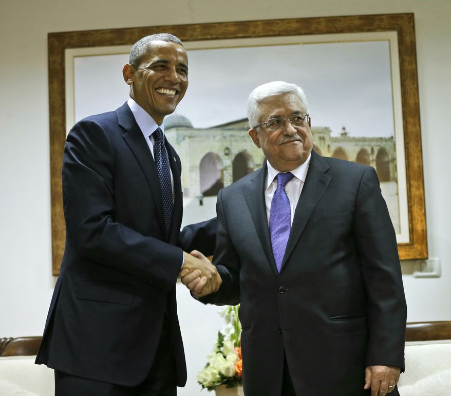 U.S. President Barack Obama and Palestinian President Mahmoud Abbas shake hands during their bilateral meeting at the Muqata Presidential Compound in the West Bank city of Ramallah, Thursday, March 21, 2013. (AP Photo/Pablo Martinez Monsivais)