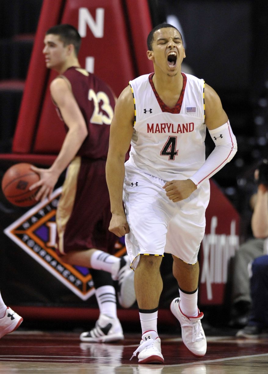 Maryland's Seth Allen (4) reacts after scoring against Denver late in the second half of a second-round game in the NIT college basketball tournament in College Park, Md., Thursday, March 21, 2013. Maryland won 62-52. (AP Photo/Gail Burton)