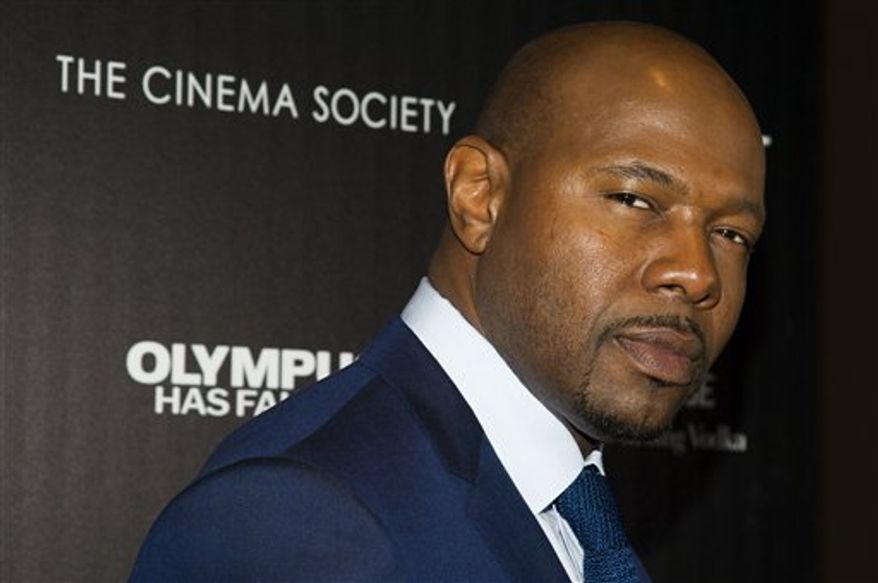 Director Antoine Fuqua attends a screening of FilmDistrict's "Olympus Has Fallen" on Monday, March 11, 2013 in New York. (Photo by Charles Sykes/Invision/AP)