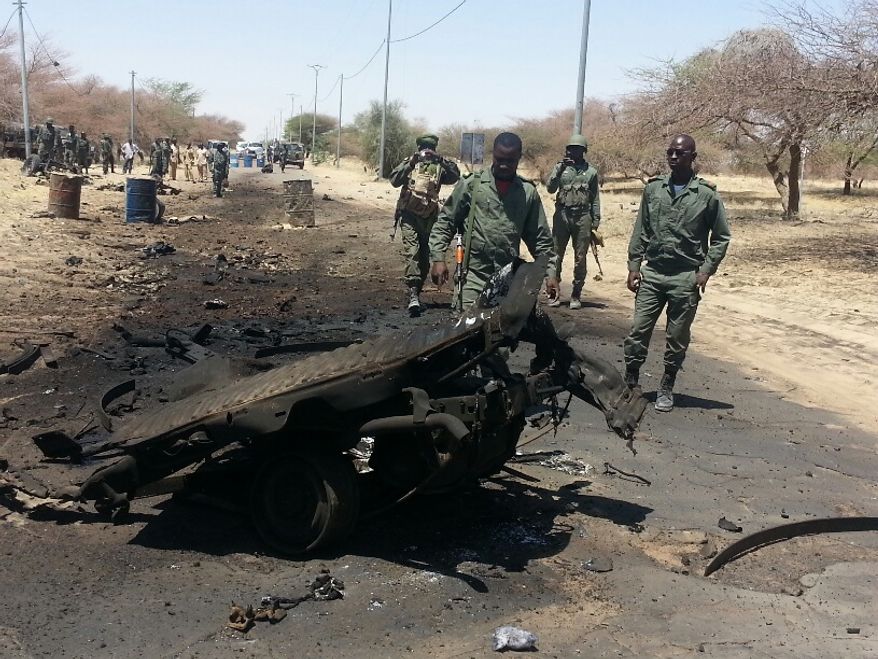 March 21: The scene is about 5 miles from Timbuktu. A suicide car bomber hit a checkpoint, injuring seven Malian soldiers. One other soldier was injured by friendly fire from French troops and died in hospital. Five insurgents were killed and one captured. An unknown number of insurgents escaped. (Photo by Yeah Samake)