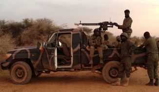 March 19: Just arrived in Timbuktu after 20 hours of grueling roads. We had four military vehicles with 20 soldiers. (Photo by John Price)