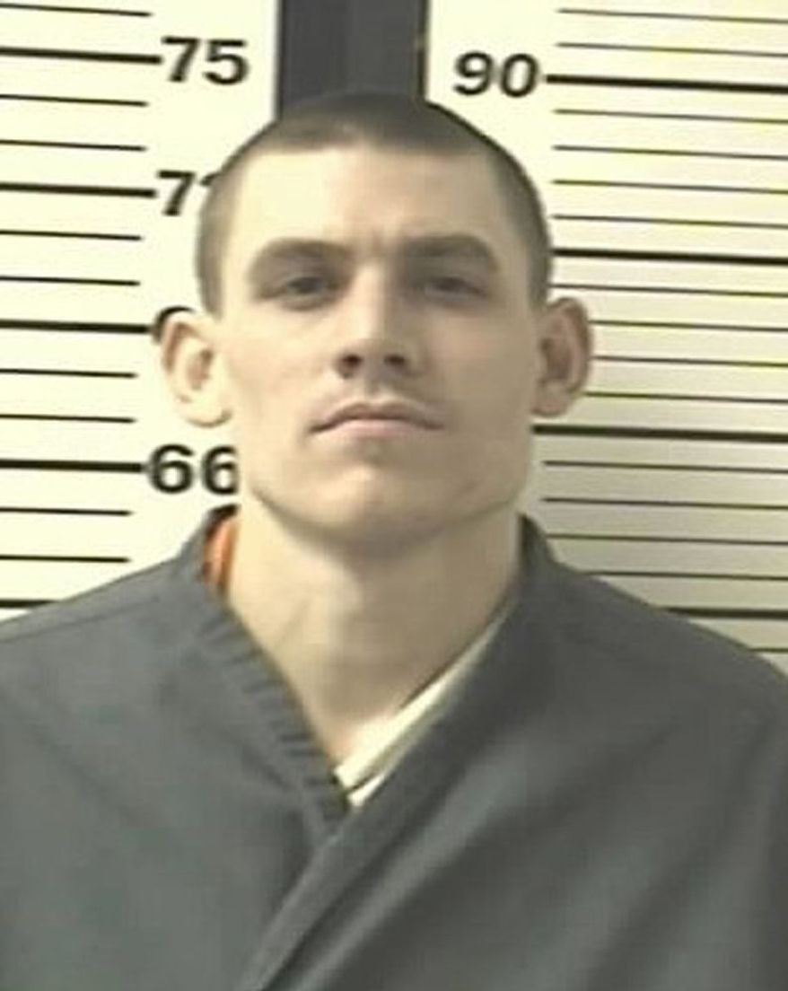 ** FILE ** Paroled inmate Evan Spencer Ebel, pictured in an undated photo, led Texas authorities on a 100-mph car chase that ended in a shootout on Thursday, March 21, 2013, and may be linked to the slaying of Colorado's state prison chief on Tuesday. (AP Photo/Colorado Department of Corrections)