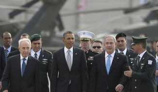 President Obama walks with Israeli Prime Minister Benjamin Netanyahu (right) and Israeli President Shimon Peres (left) across the tarmac prior to his departure from Ben Gurion International Airport in Tel Aviv on March 22, 2013. (Associated Press)