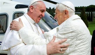 ** FILE ** Pope Francis (left) meets Pope Emeritus Benedict XVI at Castel Gandolfo, the Vatican&#39;s summer residence, on Saturday, March 23, 2013. The new pontiff had lunch with his predecessor in a historic and potentially problematic melding of the papacies that has never before confronted the Catholic Church. (Associated Press)
