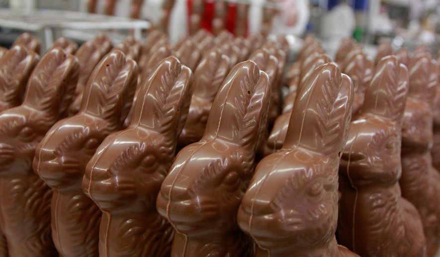 Freshly made chocolate bunnies are waiting to be placed in an Easter basket. (AP photo/file)