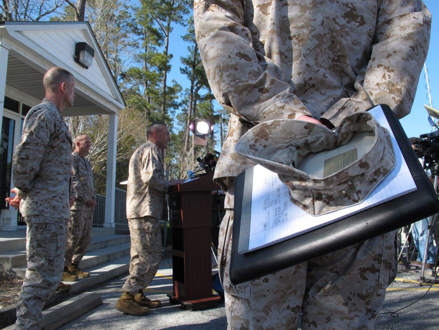 **FILE** Marine Brig. Gen. Jim Lukeman address the media outside the gates of Camp Lejeune, N.C., on March 19, 2013. Seven Marines from the base were killed in a mortar accident in Nevada the previous night. (Associated Press)