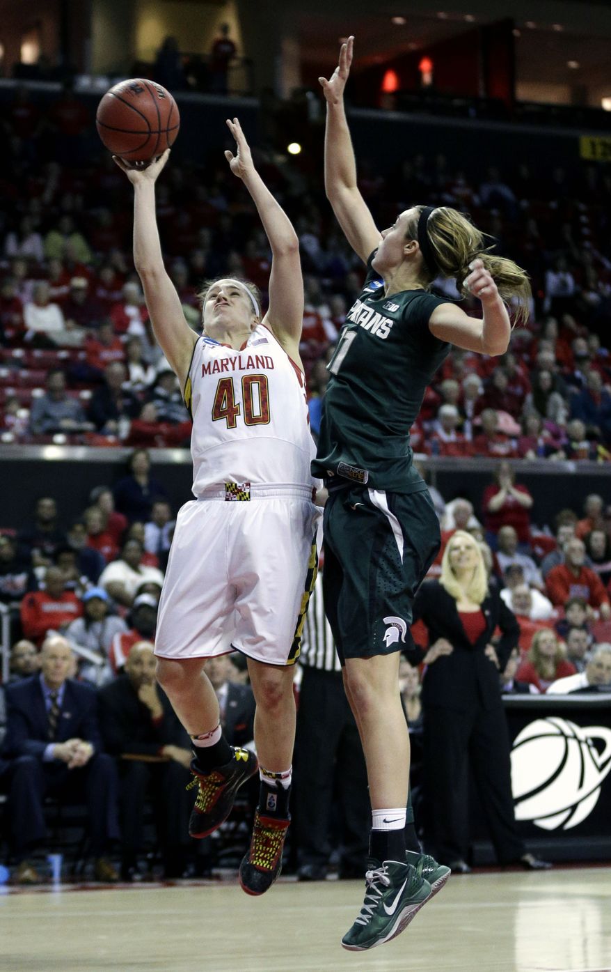 Maryland guard Katie Rutan, left, shoots over Michigan State forward Annalise Pickrel during the second half of a second-round game in the women's NCAA college basketball tournament in College Park, Md., Monday, March 25, 2013. Rutan contributed 18 points to Maryland's 74-49 win. (AP Photo/Patrick Semansky)