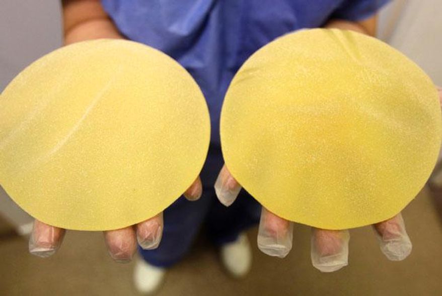 ** FILE ** Poly Implant Prothese breast implants. (Associated Press)