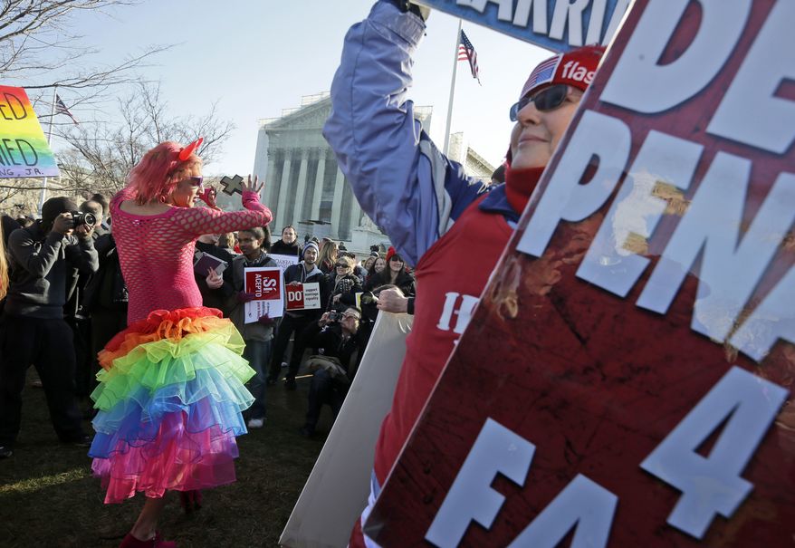 Qween Amar (left) from Orlando, Fla., dances March 26, 2013, by Margie Phelps (right), a member of the Westboro Baptist Church, outside the Supreme Court in Washington,where the court will hear arguments on California&#x27;s voter approved ban on same-sex marriage, Proposition 8. (Associated Press)
