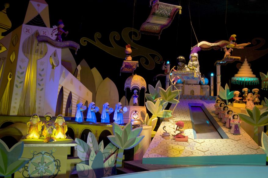 ** FILE ** This Jan. 23, 2009, file photo shows the characters Aladdin, Jasmine and Abu from the film, "Aladdin," on the "It's A Small World" ride, at Disneyland in Anaheim, Calif. An attorney says a disabled man, Jose Martinez, was awarded $8,000 by Disneyland after the “It's A Small World” ride broke in 2009, stranding him for half an hour while the theme song played continuously. (AP Photo/Damian Dovarganes, File)