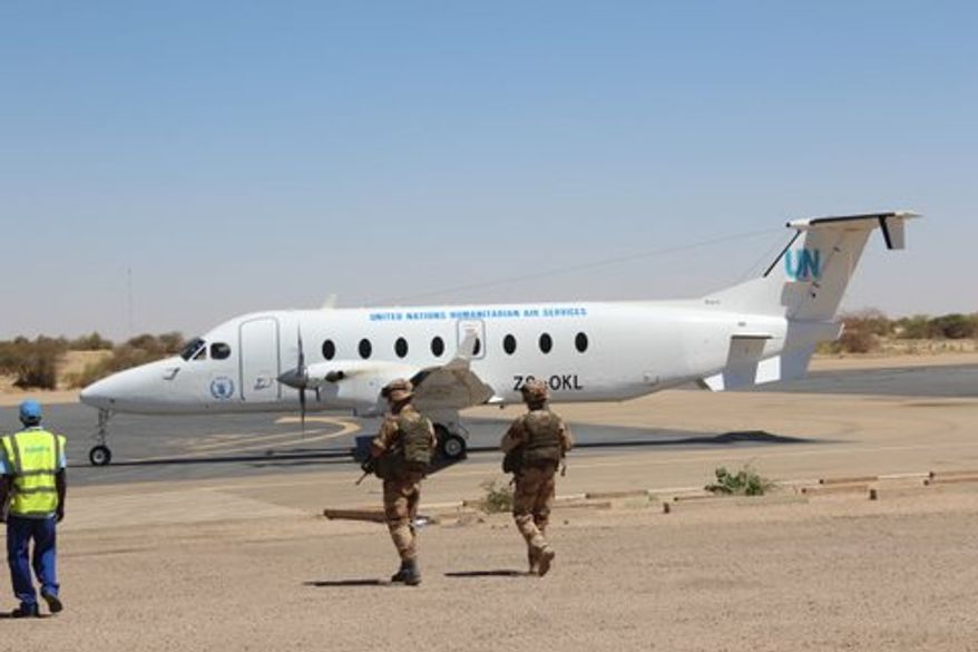 March 22: A U.N. Humanitarian Air Service plane comes to pick up journalists. (Photo by John Price)