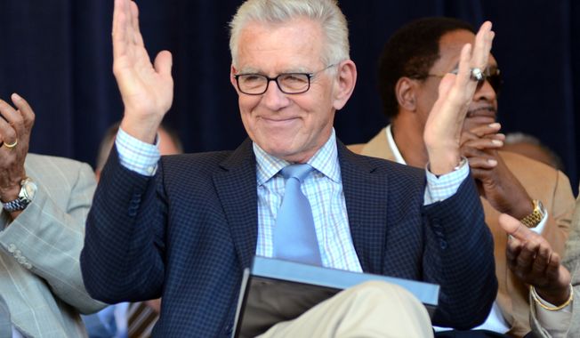 FILE - In this July 21, 2012, file photo, Tim McCarver greets the crowd before accepting the Ford C. Frick Award for excellence in baseball broadcasting as part of the Baseball Hall of Fame Induction ceremonies at Doubleday Field in Cooperstown, N.Y. McCarver says he will step down from his position at Fox after this season. (AP Photo/Heather Ainsworth, File)