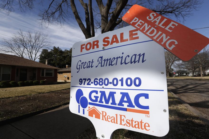 A "sale pending" announcement sits atop a "for sale" sign in the yard of a home in Richardson, Texas, on Friday, Feb. 22, 2013. (AP Photo/LM Otero)