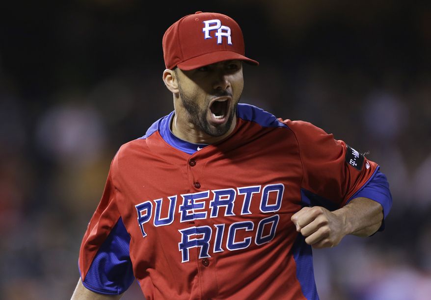Puerto Rico's J.C. Romero against Japan in a semifinal game of the World Baseball Classic in San Francisco, Sunday, March 17, 2013. (AP Photo/Eric Risberg)