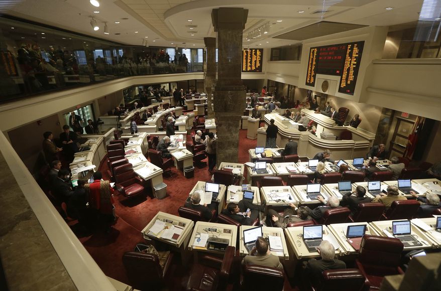 Members of the Alabama House of Representatives debate a bill at the Statehouse in Montgomery, Ala., on Tuesday, March 19, 2013. (AP Photo/Dave Martin)